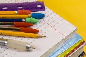 school supplies on yellow background